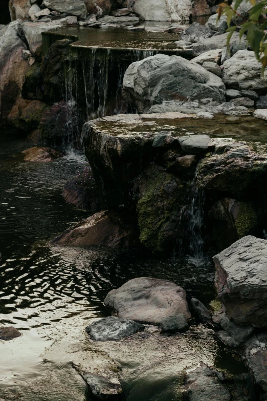 an outdoor area with rock formations and water