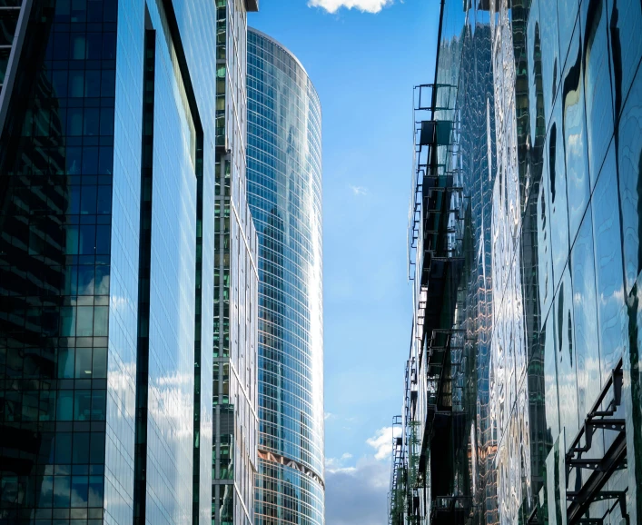 a street filled with tall buildings next to traffic