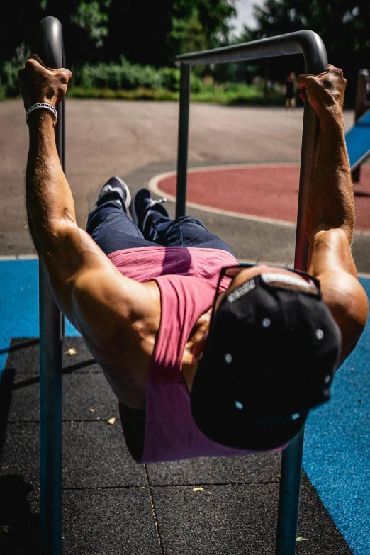 a man with a hat is doing an ablack exercise