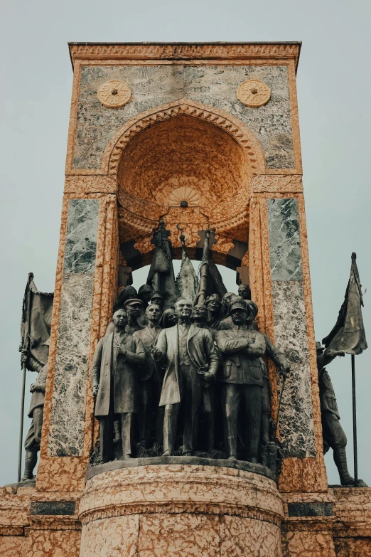 an ornate building with statues all around it