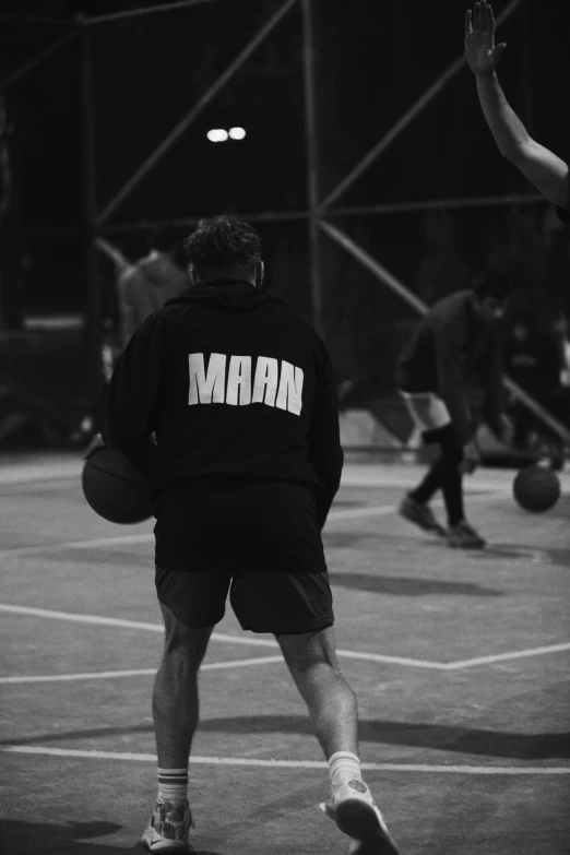 two people playing basketball together on the court