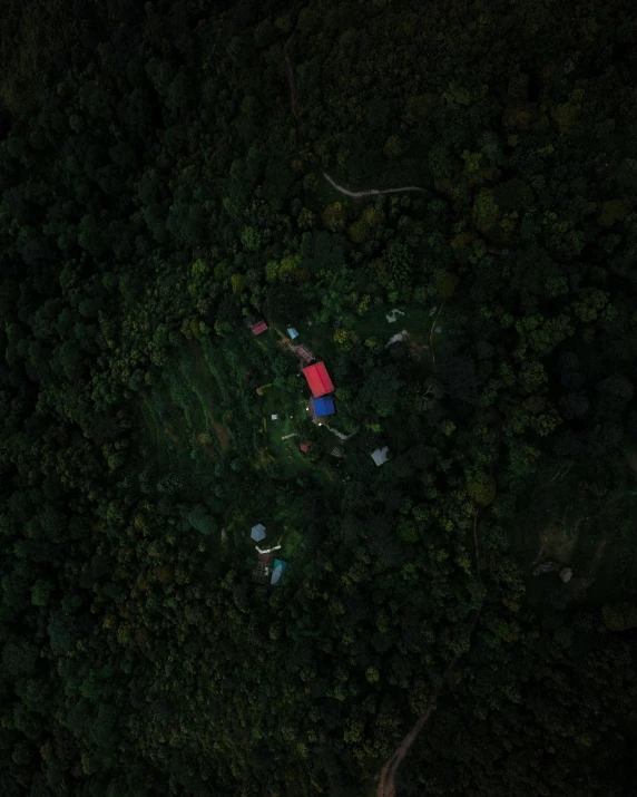 an aerial view of people camping in a park