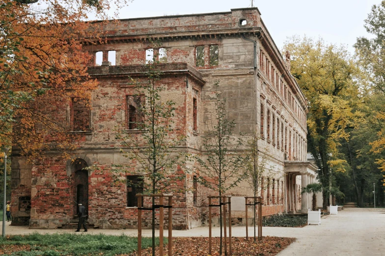 the old building is surrounded by many trees