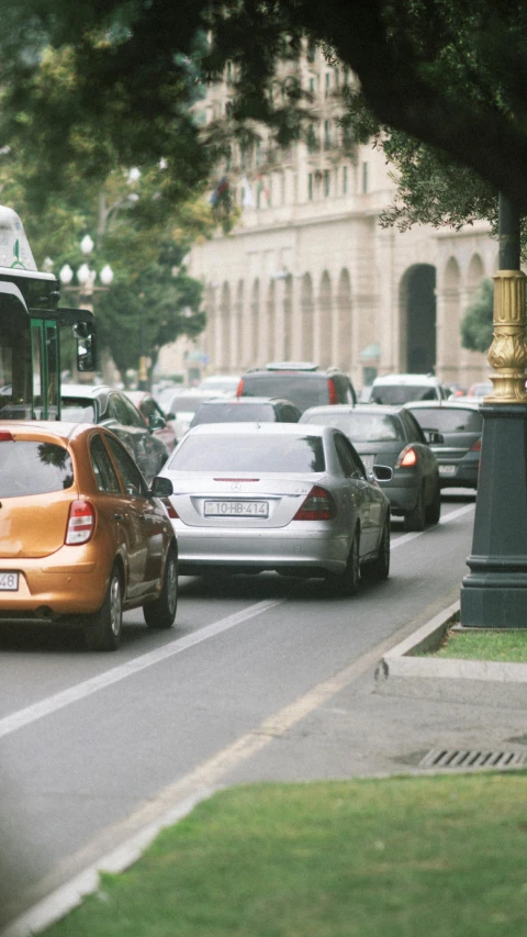 some traffic is stopped at the red light