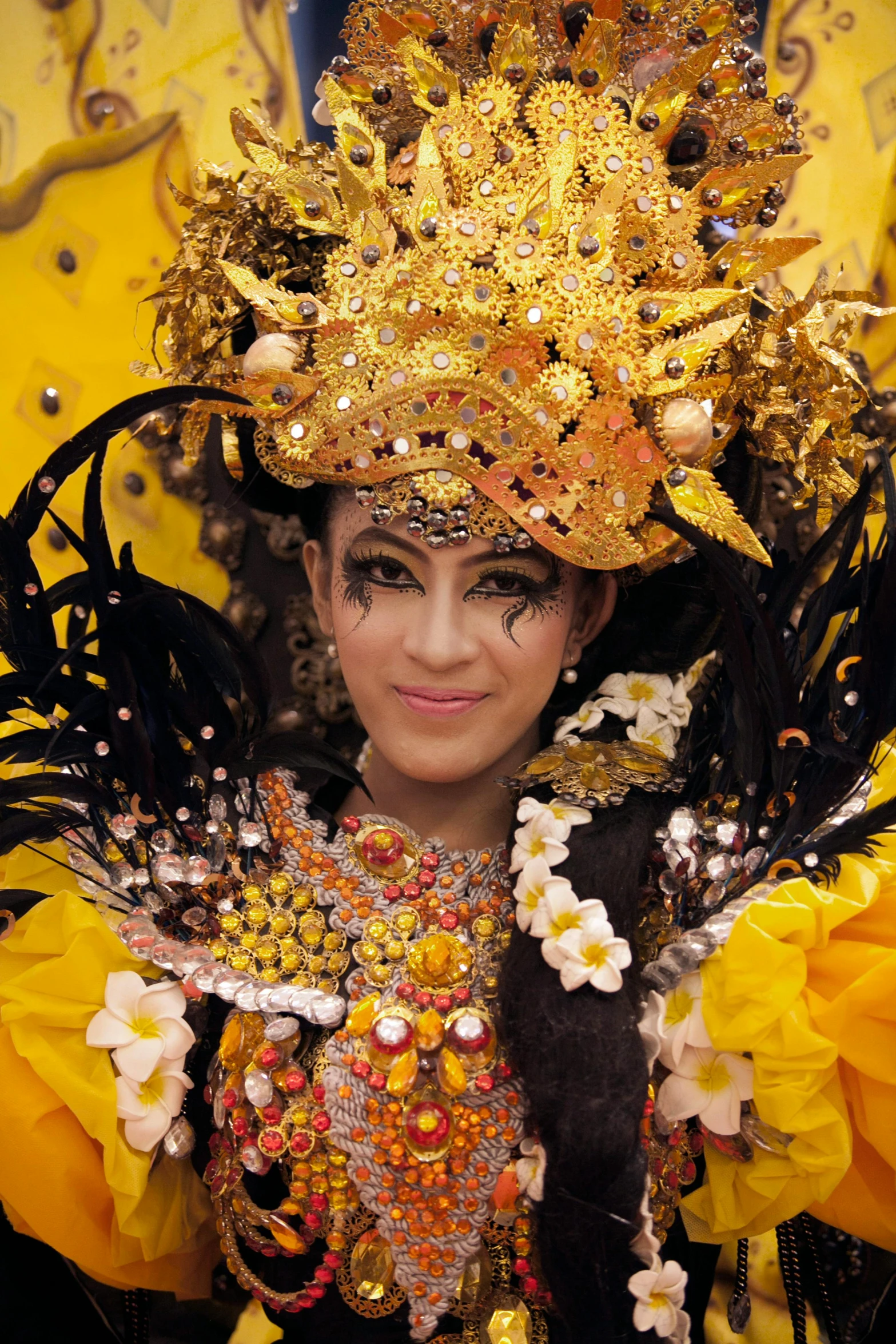 a woman in a golden dress and headdress