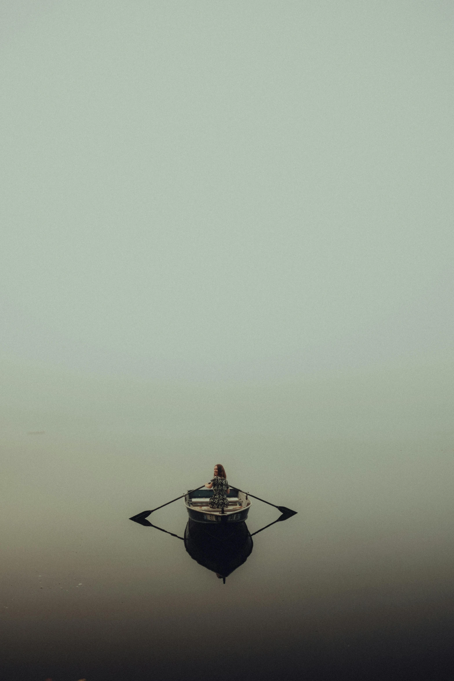 boat moving along river in foggy water