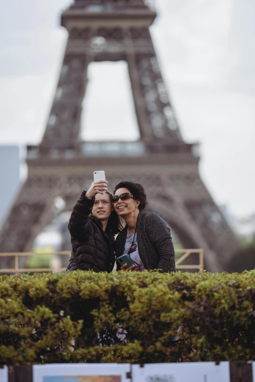 two people taking a po with a cell phone