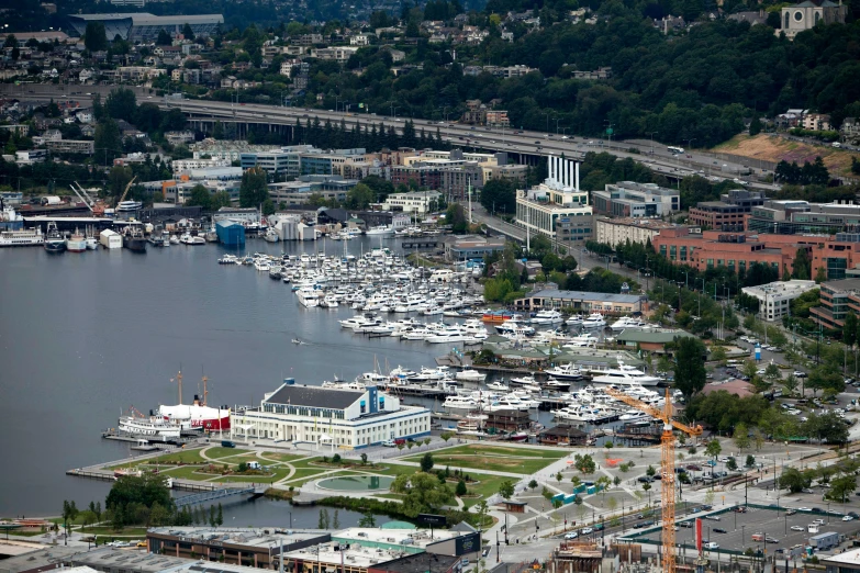 an aerial view of boats parked in the harbor at a marina