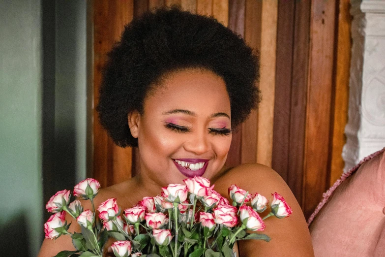 a woman is showing off her pretty flowers