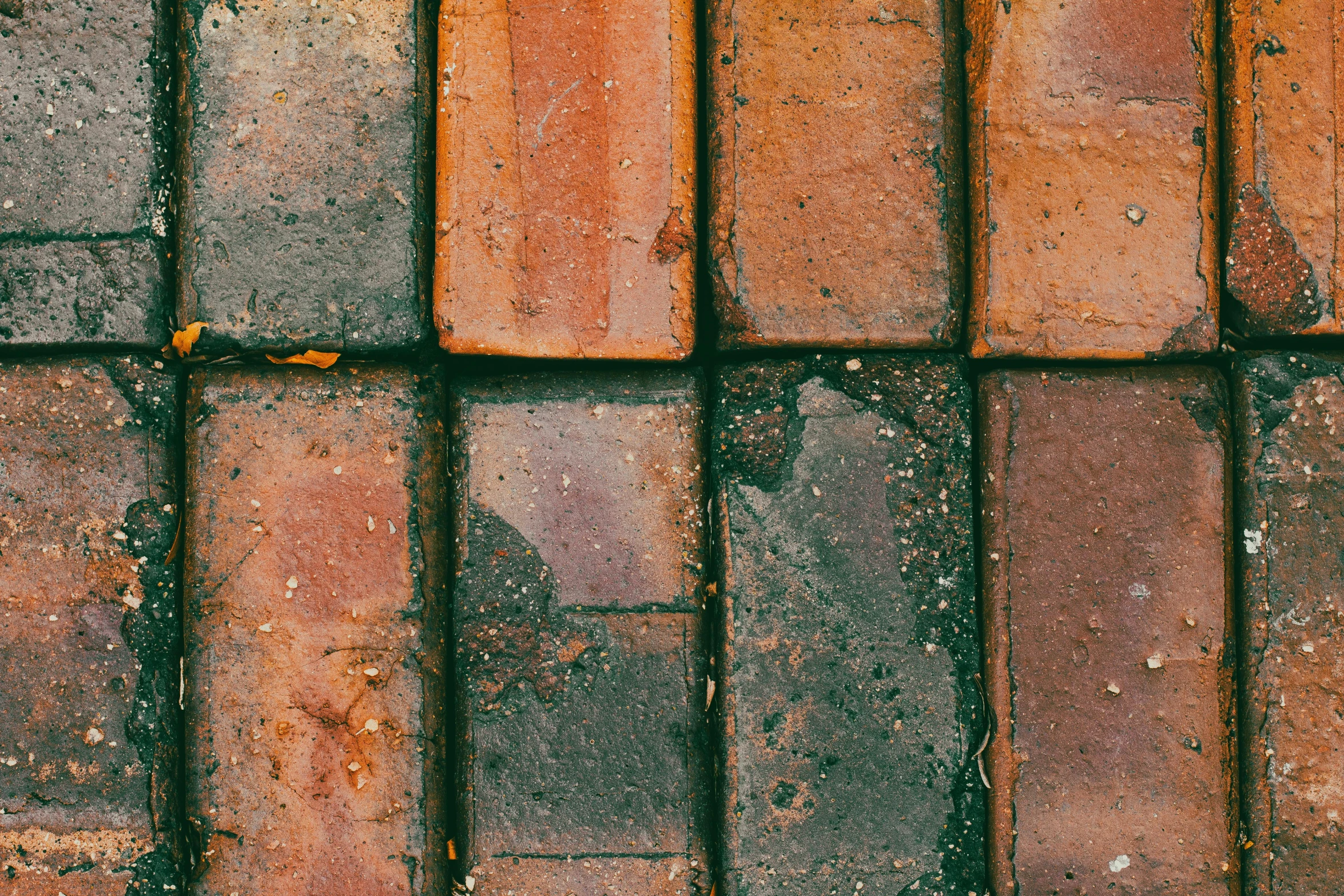 an orange and grey bricked surface that is ed