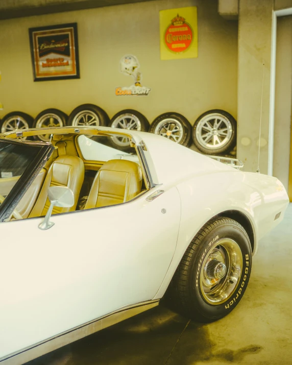 an antique white sports car with an interior