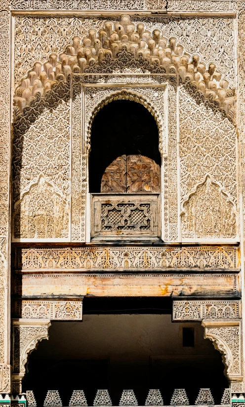 people walking on the sidewalk in front of an ornate building