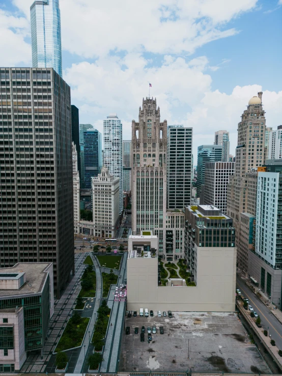 a city with skyscrs and street intersection in the foreground