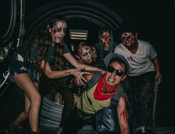 several people dressed up in zombie costumes