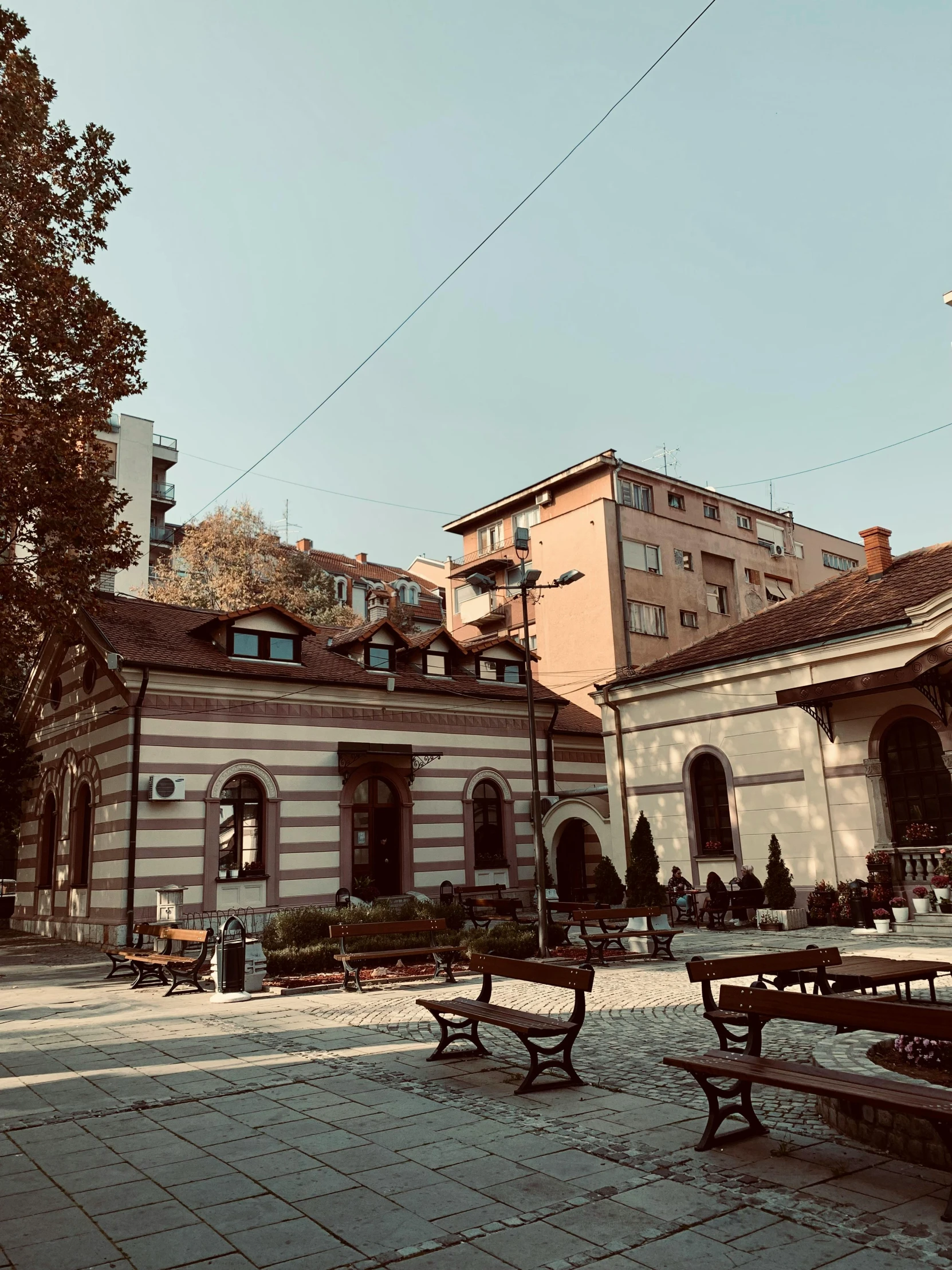 an old building and an umbrella in a courtyard