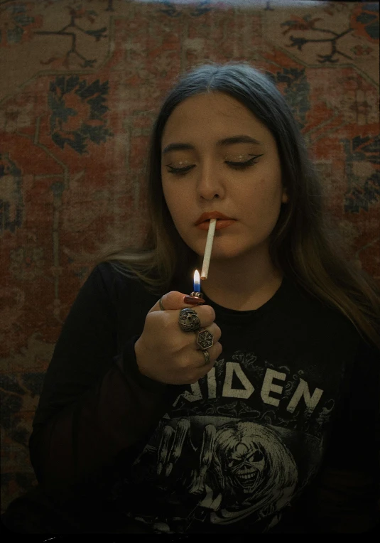 girl smoking a cigarette with her eyes closed