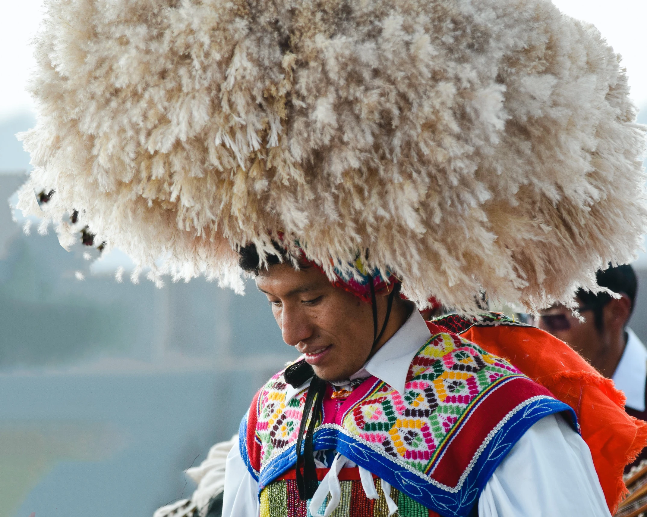 a person with a white and brown object on his head