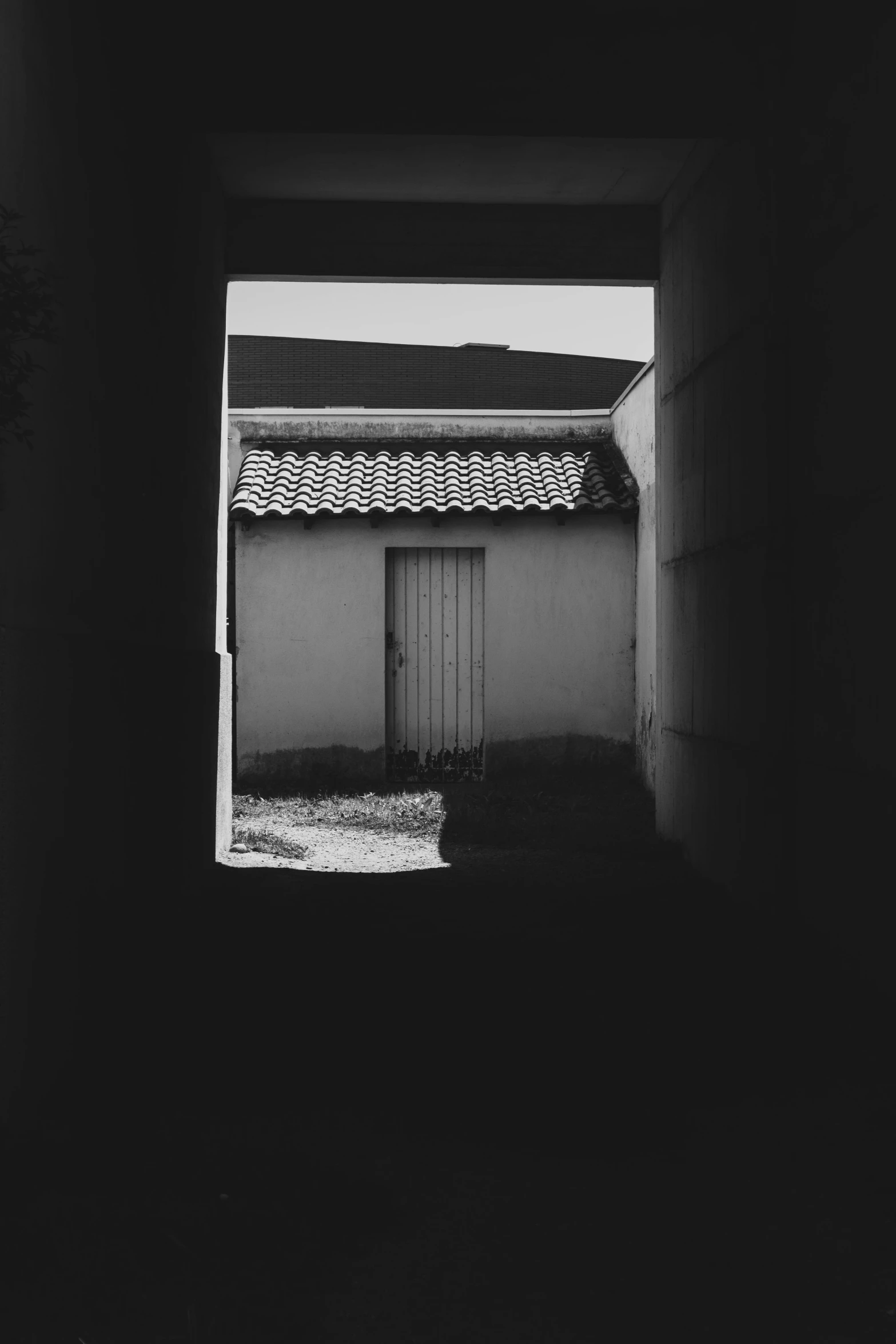 a doorway is opened to reveal a black and white po