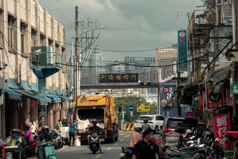 many people ride motor scooters down the street