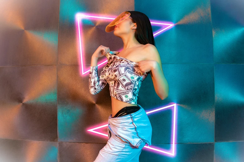 a model with very tight jeans standing in front of a neon sign