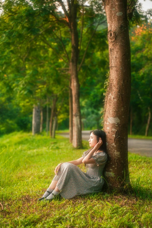 an image of a woman sitting in the grass