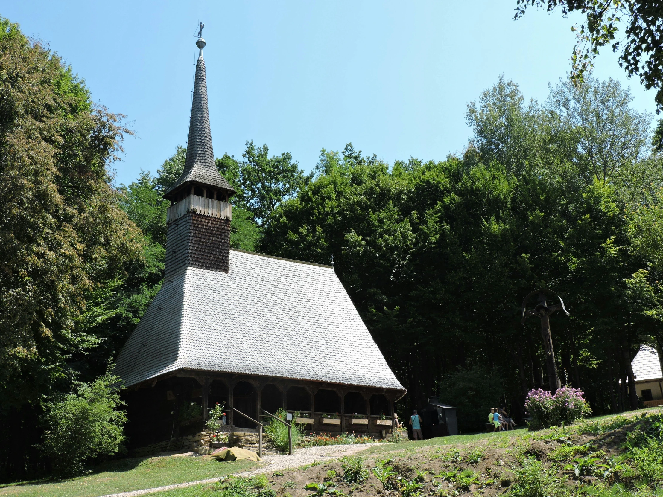 an old country church is pictured near some trees