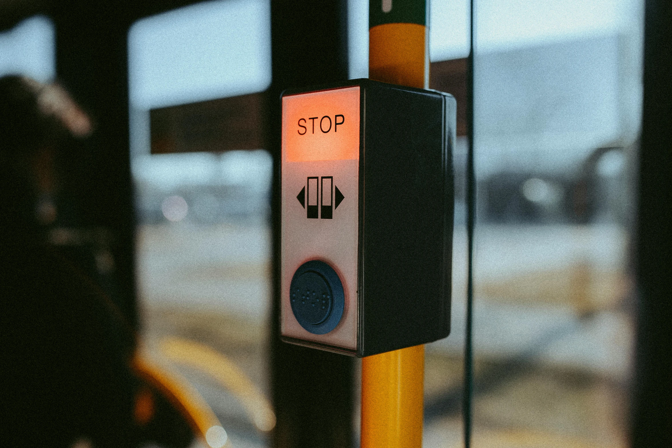 a yellow pole with a stop sign attached to it