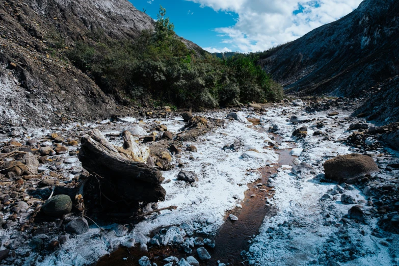 an over exposed river is seen in the middle of winter