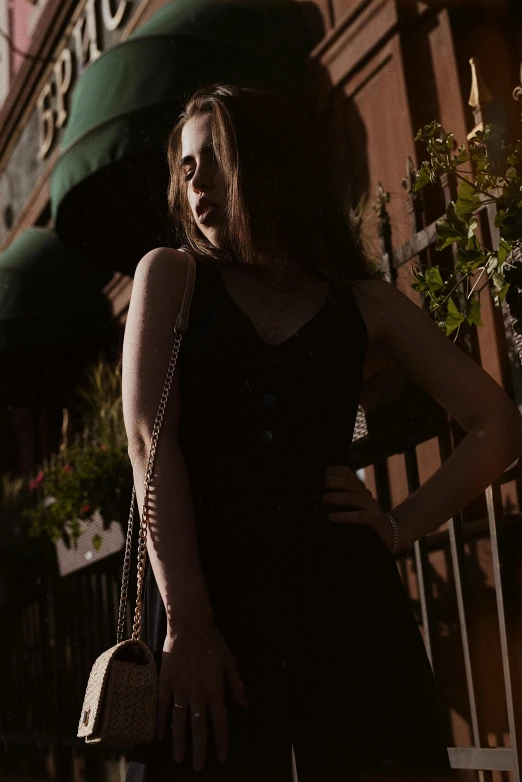 a woman posing in front of a large store