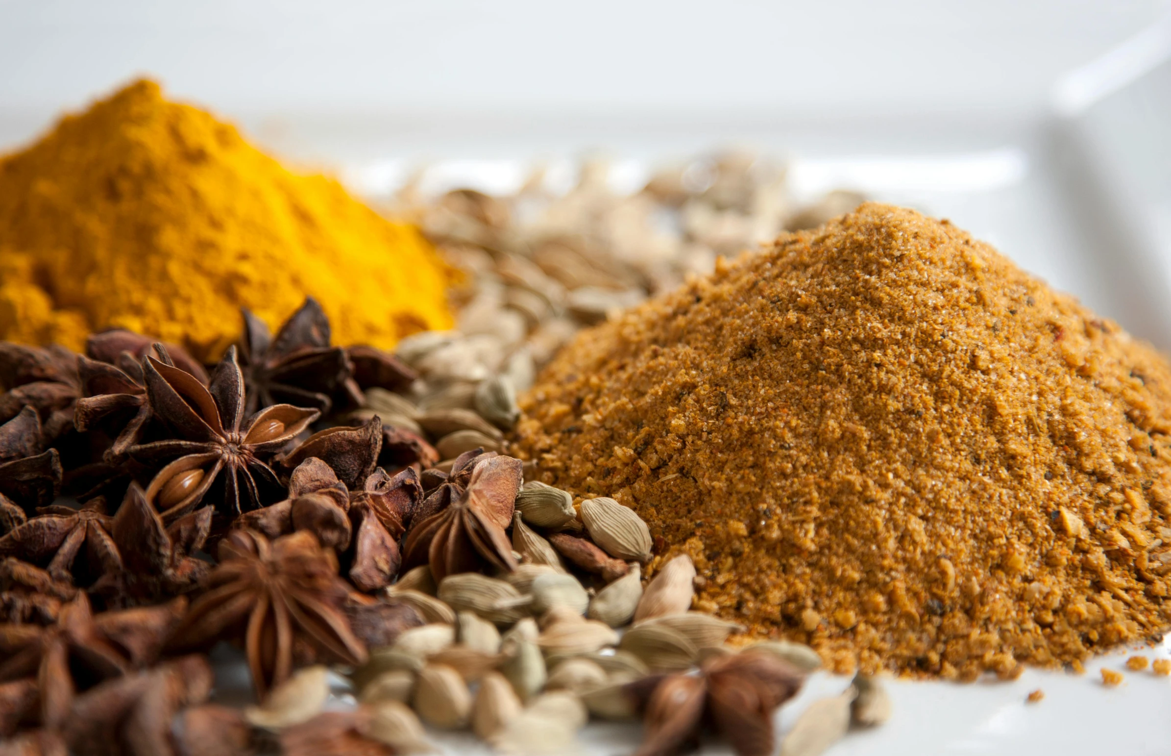 a white plate topped with various types of spices