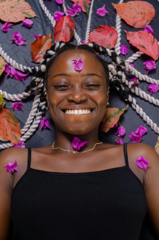 a woman with flowers and her face behind her head