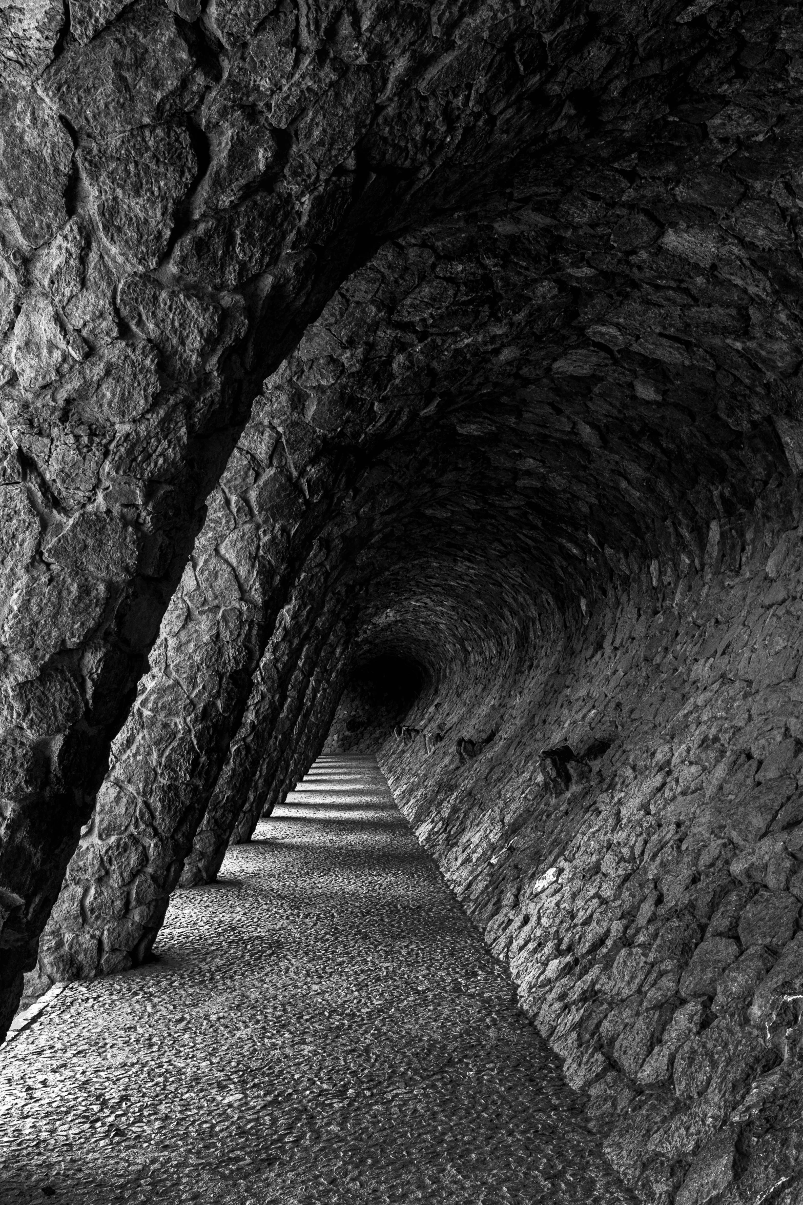 dark passage with several large rocks in it