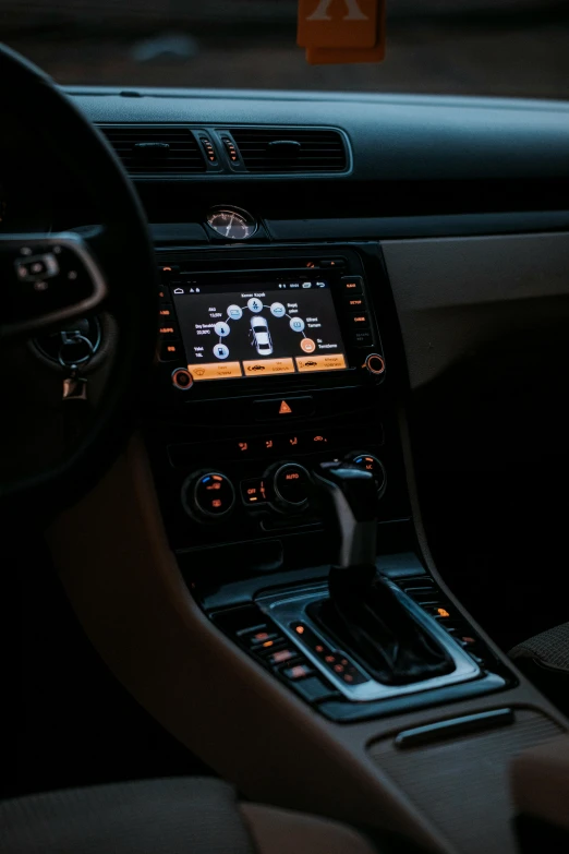 the dashboard of a vehicle with an ipod screen