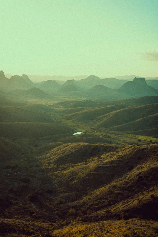 view of some green mountains and some dirt