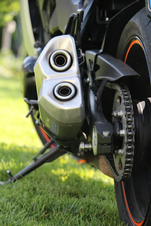 the rear wheel of a motorcycle on a lawn