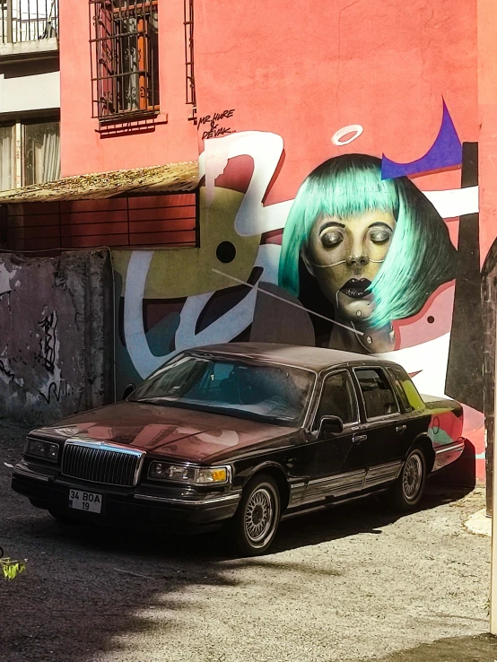 an artistic wall with a painting of a girl with a green wig