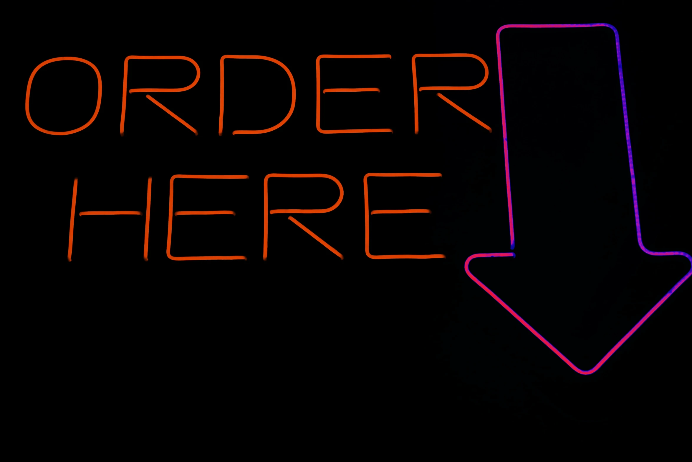 an image of a neon sign with the name order here