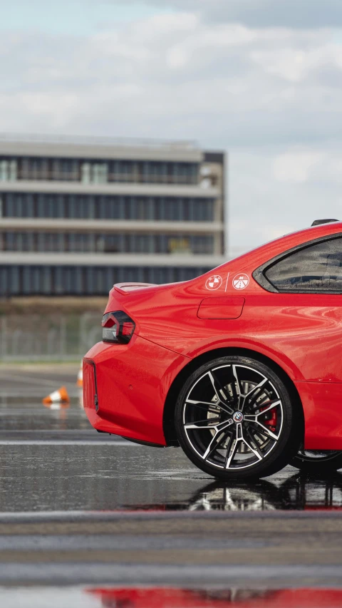 an image of a red sports car in a parking lot