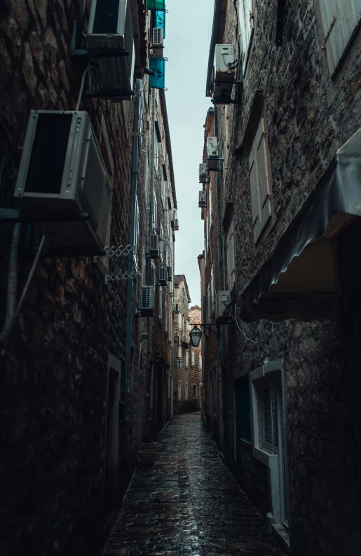 the street is long and very narrow, with small windows