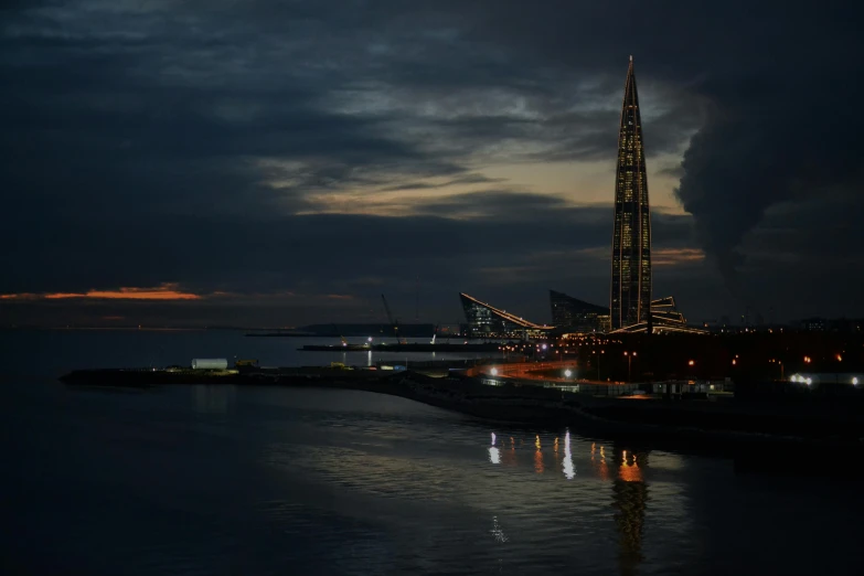 a nighttime view of a very tall tower