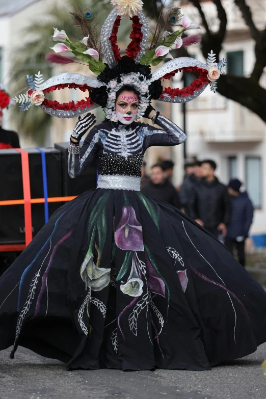 a woman wearing a colorful day of the dead dress