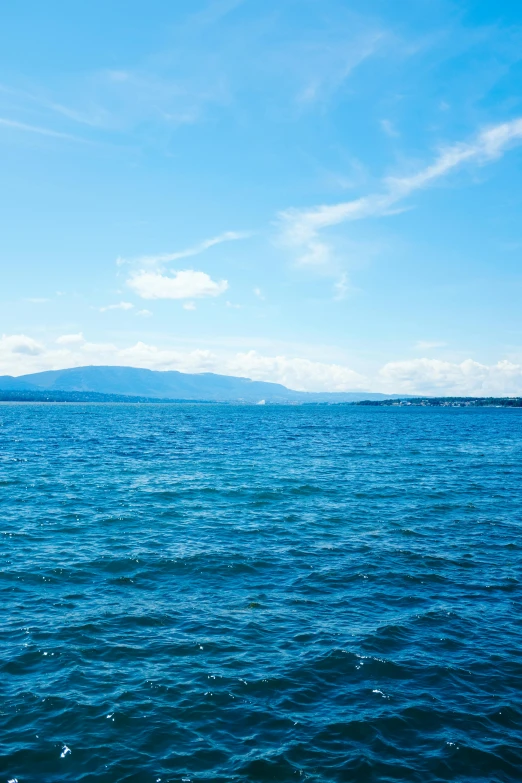 a boat floating on top of the ocean