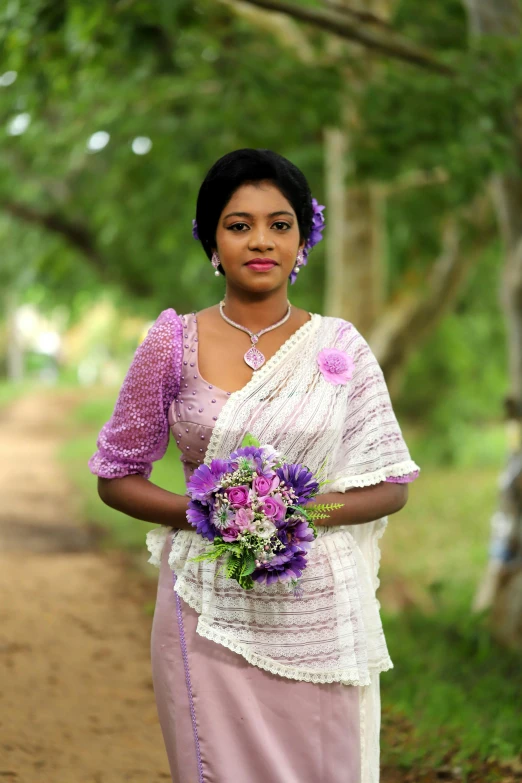 the woman is wearing a dress that has flower on it