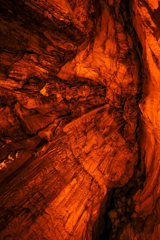 an orange view of rocks and water in an interior