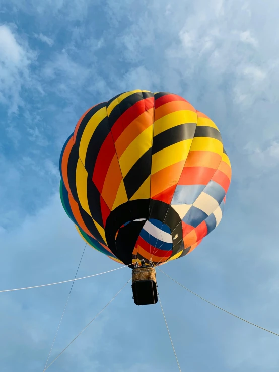 a colorful  air balloon floating in the sky