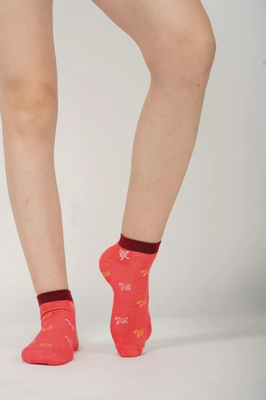 woman wearing bright socks with stars and hearts on them