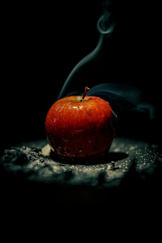 a red apple that has some smoke in it