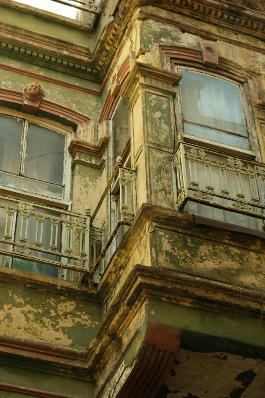 an old run down building with faded paint