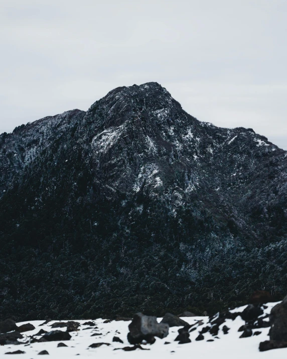 the mountains with snow all over them are seen