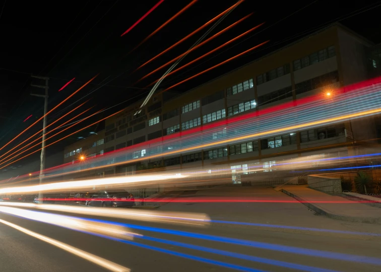 blurry image of buildings in the distance with light streaks